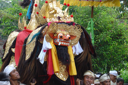 Barong "mythical creatures" moving on the road