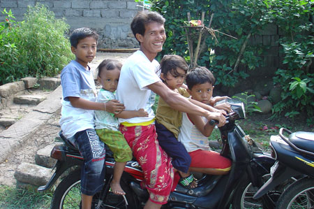 Bali family on a motorbike
